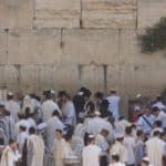 Placing prayer petitions in the Wailing Wall
