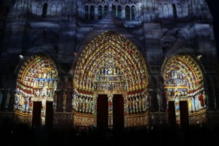 The entrance to Amiens Cathedral at night
