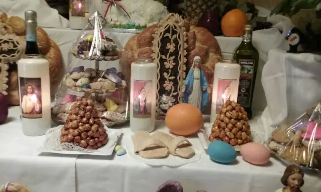 Note the sanadals made from bread dough on Saint Joseph's Table