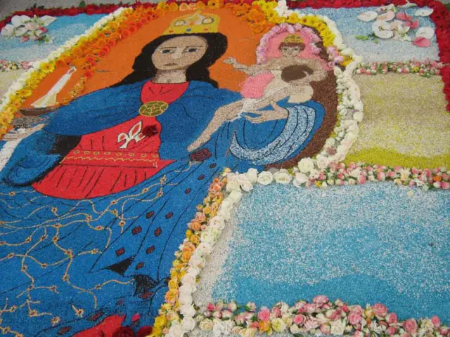 The sidewalks are colorfully decorated for the procession of  Our Lady of Bonaria