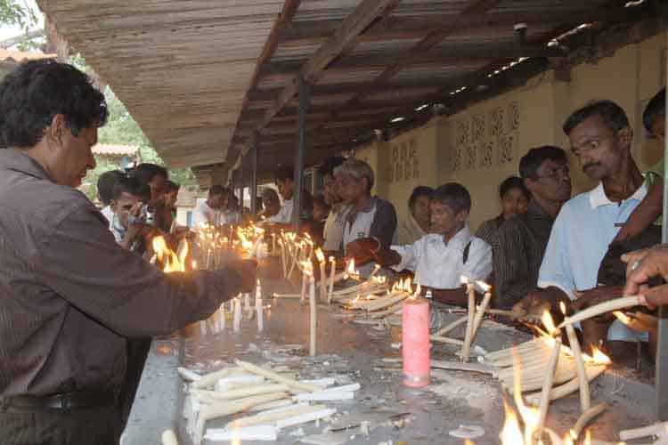 Pilgrims lighting candles at the Madhu Shrine of Our Lady of the Rosary
