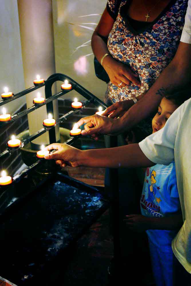 Lighting candles at the Shrine of Saint Jude in Faversham