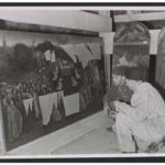 Monuments Man Daniel J. Kern & art restorer Karl Sieber looking at panels of Adroration of the Mystic lamb in the Alataussee mine, 1945