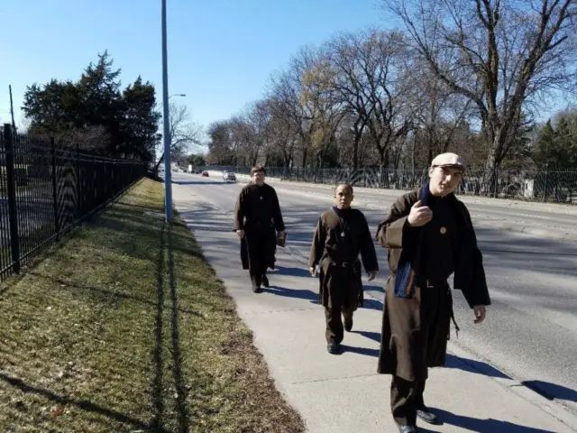 The Knights of the Holy Eucharist walking