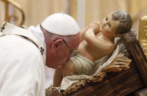 Pope Francis kissing Bambinelli in St Peter's Square