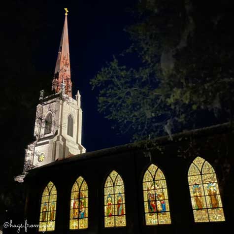 View of the windows at night at st clare catholic church in charleston